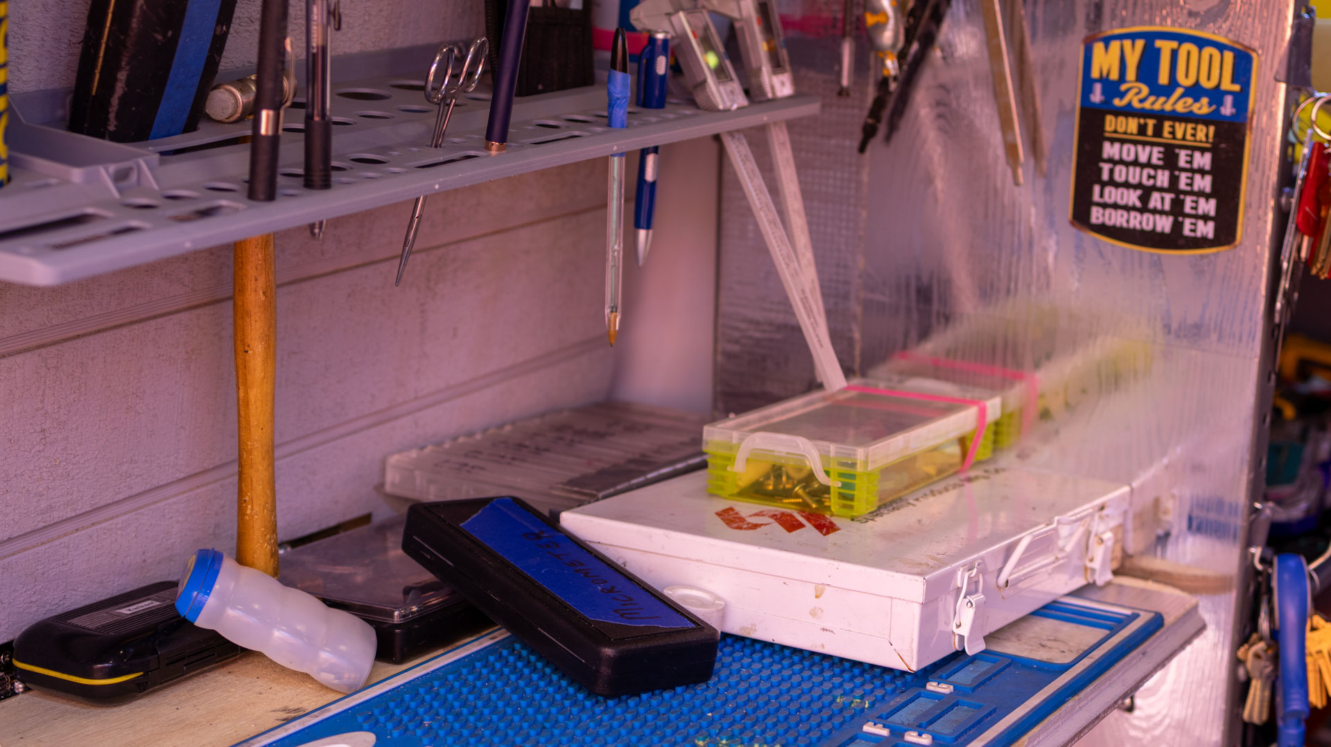 Professional locksmith workspace with organized tools